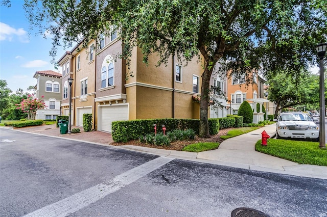 4244 Messina Dr, Lake Mary, FL 32746 - view of property with a garage and a residential view