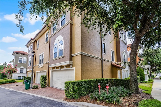 4244 Messina Dr, Lake Mary, FL 32746 - view of building exterior featuring a garage and driveway