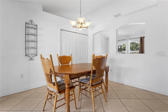144 Fort Smith Blvd, Deltona, FL 32738 - dining area with light tile patterned floors, a chandelier, and arched walkways