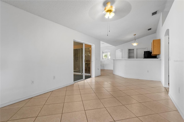 144 Fort Smith Blvd, Deltona, FL 32738 - unfurnished room featuring arched walkways, a ceiling fan, vaulted ceiling, and light tile patterned floors