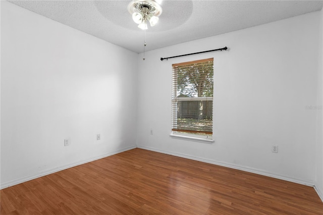 144 Fort Smith Blvd, Deltona, FL 32738 - empty room featuring wood finished floors, ceiling fan, and a textured ceiling