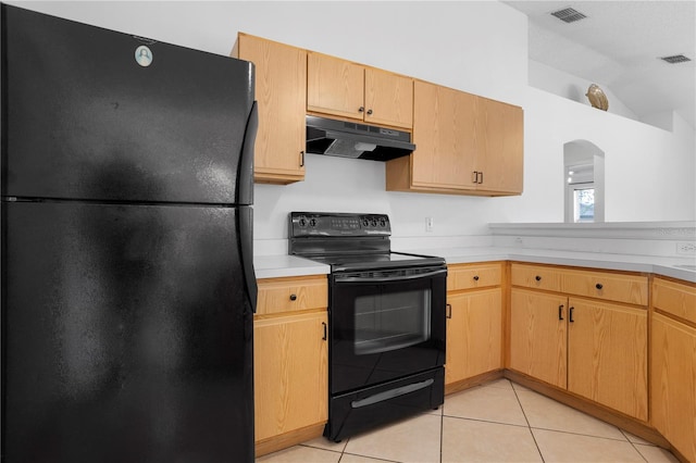 144 Fort Smith Blvd, Deltona, FL 32738 - kitchen with black appliances, under cabinet range hood, light countertops, vaulted ceiling, and light tile patterned floors