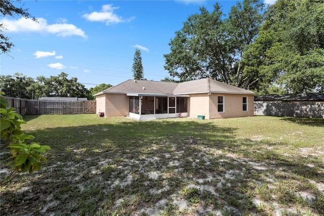 144 Fort Smith Blvd, Deltona, FL 32738 - rear view of property featuring a sunroom, a fenced backyard, and roof with shingles