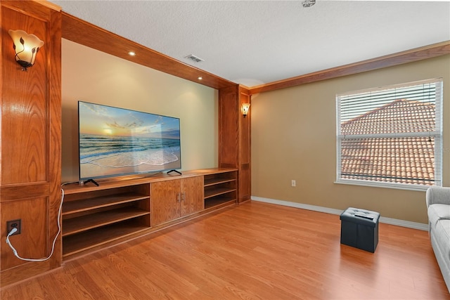 9128 Phillips Grove Ter, Orlando, FL 32836 - unfurnished living room with light wood-style floors, a textured ceiling, and recessed lighting