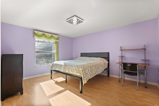 9128 Phillips Grove Ter, Orlando, FL 32836 - bedroom with light wood-style floors and baseboards