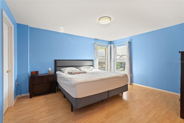 9128 Phillips Grove Ter, Orlando, FL 32836 - bedroom with light wood-type flooring and baseboards