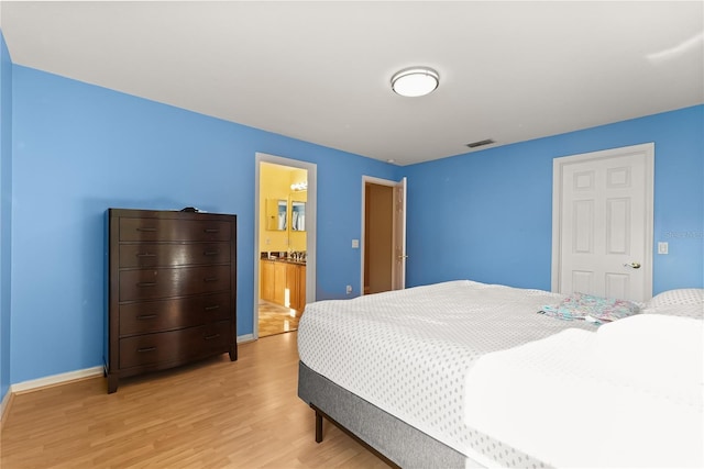 9128 Phillips Grove Ter, Orlando, FL 32836 - bedroom featuring light wood-style flooring and baseboards