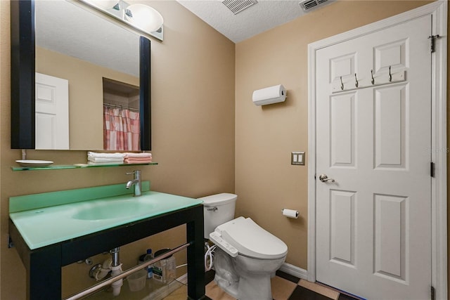 9128 Phillips Grove Ter, Orlando, FL 32836 - full bathroom featuring vanity and a textured ceiling