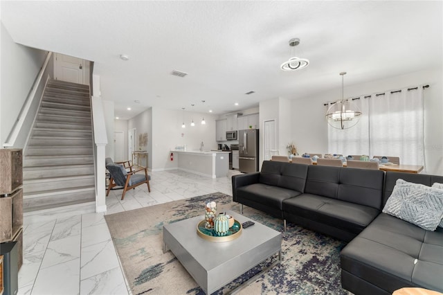 4974 Windermere Ave, Kissimmee, FL 34746 - living area with light marble finish floors, stairway, and recessed lighting