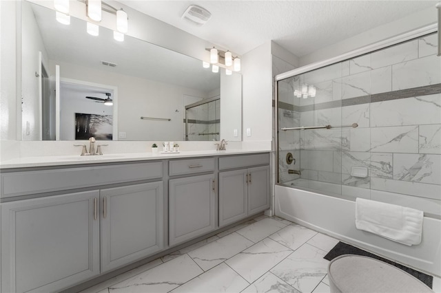 4974 Windermere Ave, Kissimmee, FL 34746 - bathroom with marble finish floors, double vanity, enclosed tub / shower combo, and ceiling fan