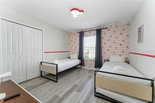 4974 Windermere Ave, Kissimmee, FL 34746 - bedroom featuring light wood-style flooring and a closet