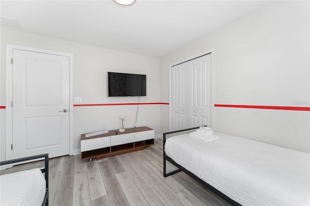 4974 Windermere Ave, Kissimmee, FL 34746 - bedroom with wood finished floors and a closet