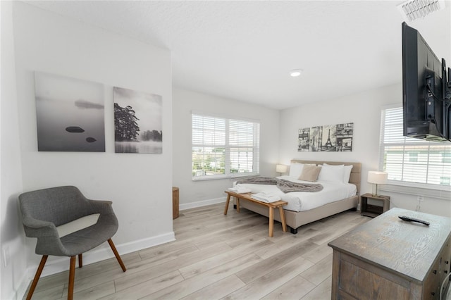 4974 Windermere Ave, Kissimmee, FL 34746 - bedroom with light wood-type flooring and baseboards