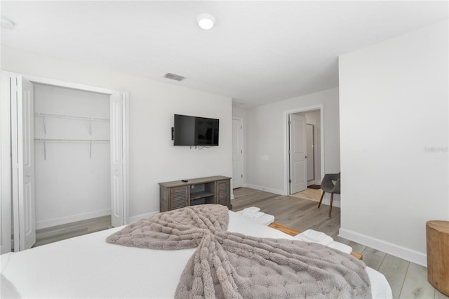4974 Windermere Ave, Kissimmee, FL 34746 - bedroom featuring light wood finished floors and a closet