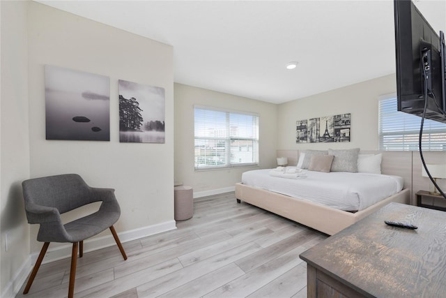 4974 Windermere Ave, Kissimmee, FL 34746 - bedroom featuring light wood-type flooring and multiple windows