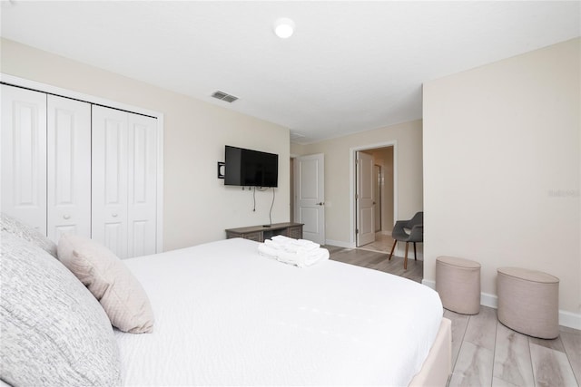 4974 Windermere Ave, Kissimmee, FL 34746 - bedroom with a closet and light wood-style flooring