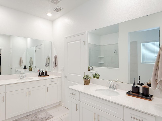 13993 Title Way, Winter Garden, FL 34787 - full bath featuring two vanities, tile patterned floors, and a shower