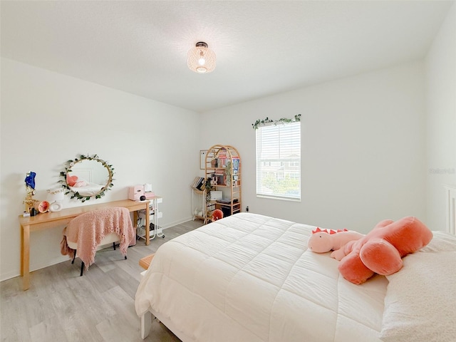 13993 Title Way, Winter Garden, FL 34787 - bedroom with light wood-type flooring and baseboards