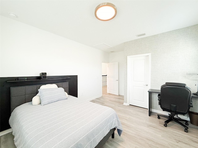 13993 Title Way, Winter Garden, FL 34787 - bedroom with light wood finished floors, a desk, and attic access