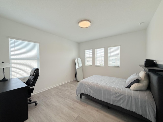 13993 Title Way, Winter Garden, FL 34787 - bedroom featuring light wood-style floors and a desk