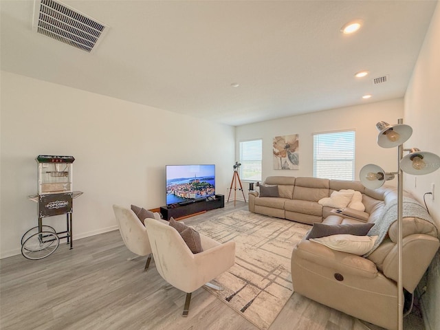 13993 Title Way, Winter Garden, FL 34787 - living area featuring wood finished floors and recessed lighting