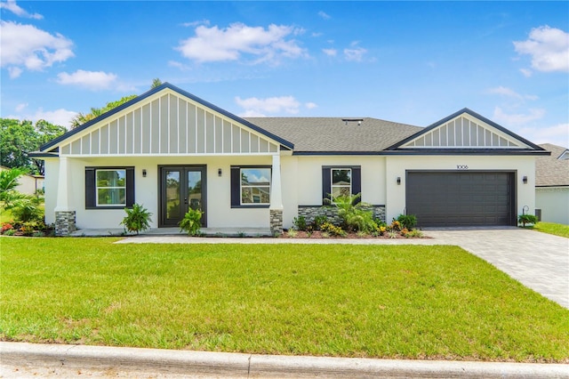 1006 Linkside Ct, Apopka, FL 32712 - view of front of property with french doors, a garage, decorative driveway, a front lawn, and roof with shingles