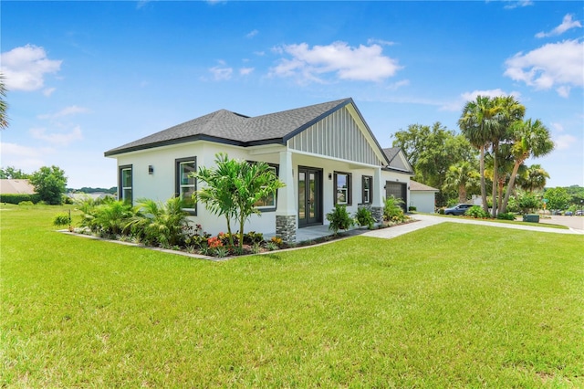 1006 Linkside Ct, Apopka, FL 32712 - view of front of home with concrete driveway, a front lawn, a garage, board and batten siding, and roof with shingles
