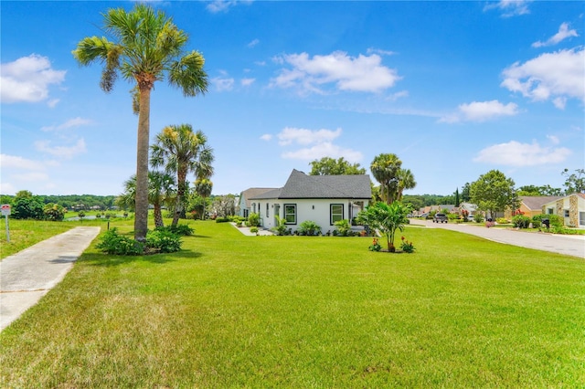 1006 Linkside Ct, Apopka, FL 32712 - view of front facade with a front lawn, driveway, and stucco siding