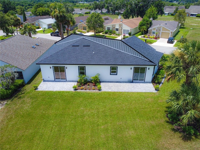1006 Linkside Ct, Apopka, FL 32712 - back of property featuring a shingled roof, a residential view, and stucco siding