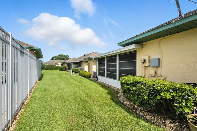 3280 Villa Way Cir, Saint Cloud, FL 34769 - view of grassy yard with a sunroom