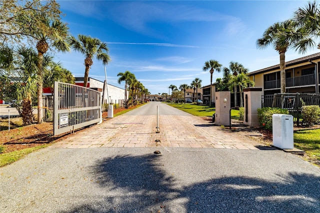 1042 Mollie Ln Unit 81042, Melbourne, FL 32935 - view of road featuring a residential view and a gate
