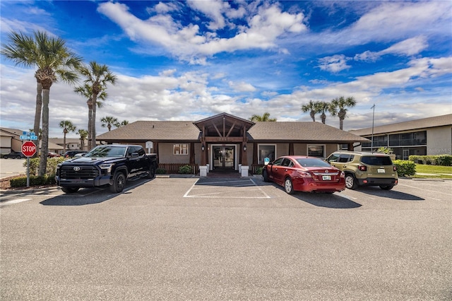 1042 Mollie Ln Unit 81042, Melbourne, FL 32935 - view of front of property featuring uncovered parking and french doors