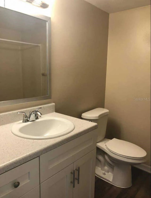 1042 Mollie Ln Unit 81042, Melbourne, FL 32935 - full bathroom with vanity, wood finished floors, and a shower