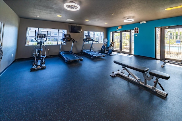 1042 Mollie Ln Unit 81042, Melbourne, FL 32935 - exercise room featuring a textured ceiling and recessed lighting