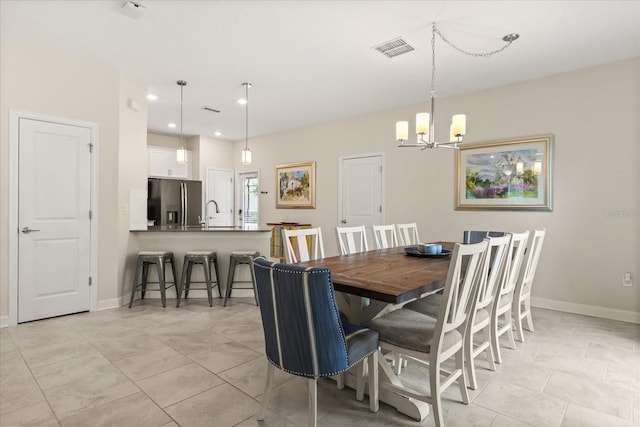 1351 Shinnecock Hills Dr, Davenport, FL 33896 - dining area with a chandelier, recessed lighting, and light tile patterned flooring