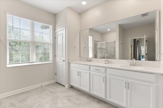 1351 Shinnecock Hills Dr, Davenport, FL 33896 - full bathroom featuring double vanity and a shower stall