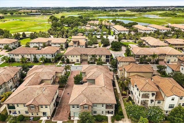 1351 Shinnecock Hills Dr, Davenport, FL 33896 - aerial perspective of suburban area with a golf club and a large body of water