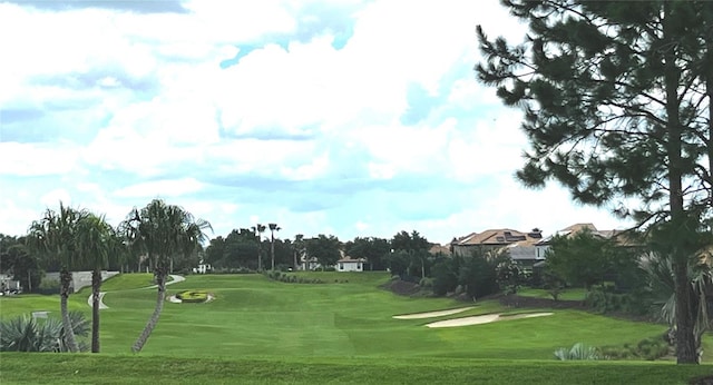 1351 Shinnecock Hills Dr, Davenport, FL 33896 - surrounding community featuring view of golf course and a yard