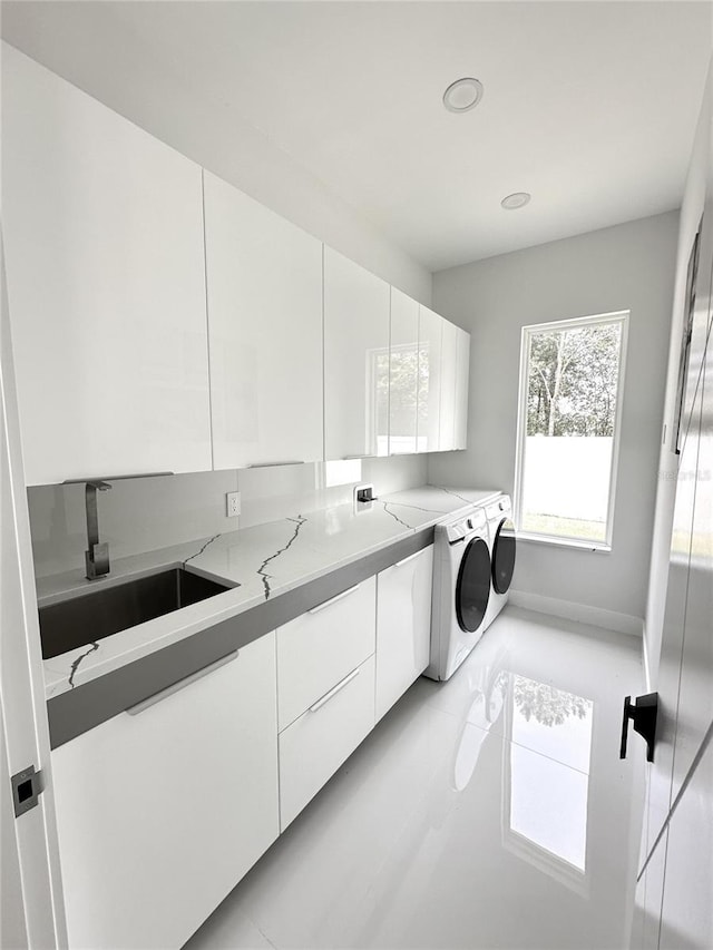 9 Edison Ln, Palm Coast, FL 32164 - washroom with independent washer and dryer, cabinet space, recessed lighting, and light tile patterned floors