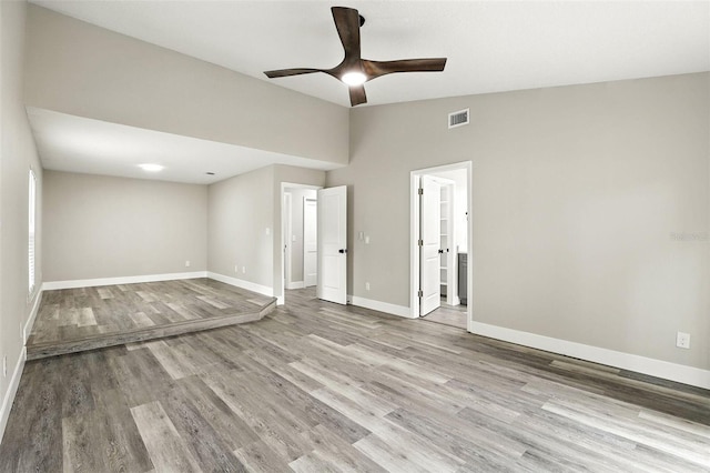 1850 N St, Longwood, FL 32750 - empty room with wood finished floors, a ceiling fan, and vaulted ceiling