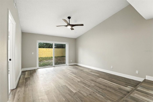 1850 N St, Longwood, FL 32750 - empty room featuring wood finished floors, ceiling fan, and vaulted ceiling