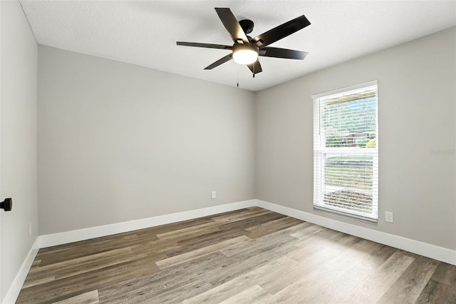 1850 N St, Longwood, FL 32750 - empty room featuring wood finished floors and a ceiling fan