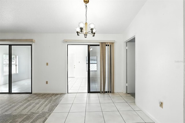 22 Bradford Ct, Kissimmee, FL 34758 - unfurnished room with a chandelier and light tile patterned flooring