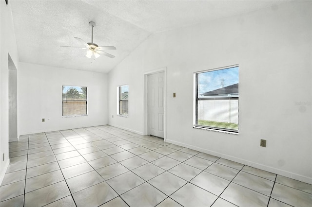 22 Bradford Ct, Kissimmee, FL 34758 - unfurnished room with a ceiling fan, vaulted ceiling, light tile patterned flooring, and a textured ceiling