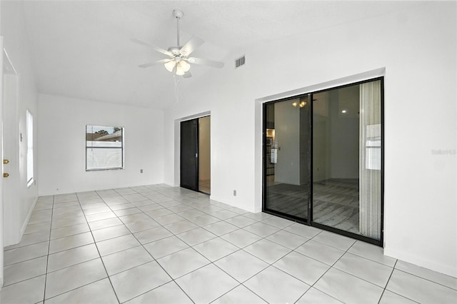 22 Bradford Ct, Kissimmee, FL 34758 - empty room featuring lofted ceiling, a ceiling fan, and light tile patterned floors