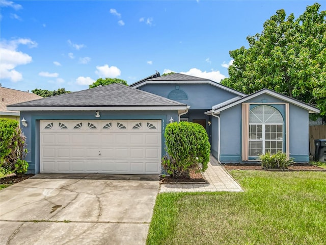 1131 Tyler Lake Cir, Orlando, FL 32839 - ranch-style home featuring driveway, a front lawn, a garage, stucco siding, and roof with shingles