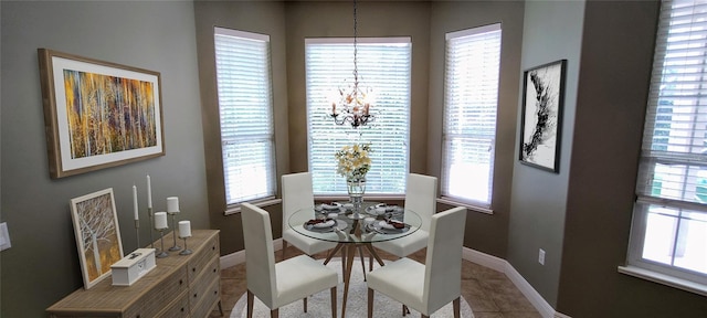 5595 Schefflera, Grant, FL 32949 - dining space with a chandelier, plenty of natural light, and tile patterned floors
