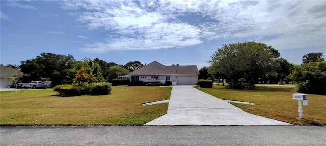 5595 Schefflera, Grant, FL 32949 - view of front of property with a garage, a front yard, and driveway