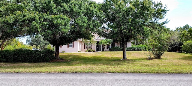 5595 Schefflera, Grant, FL 32949 - view of front of property featuring a front lawn and stucco siding