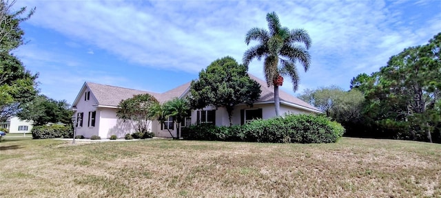 5595 Schefflera, Grant, FL 32949 - view of front of property with stucco siding and a front yard